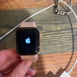 Gently used Apple Watch Series 6 . With light pink small band, charging cable.